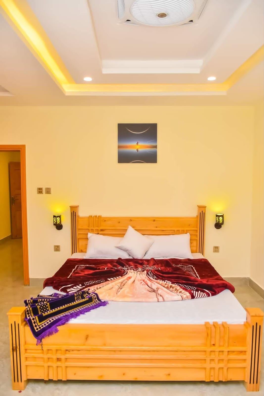 Warm wooden hotel room with double bed